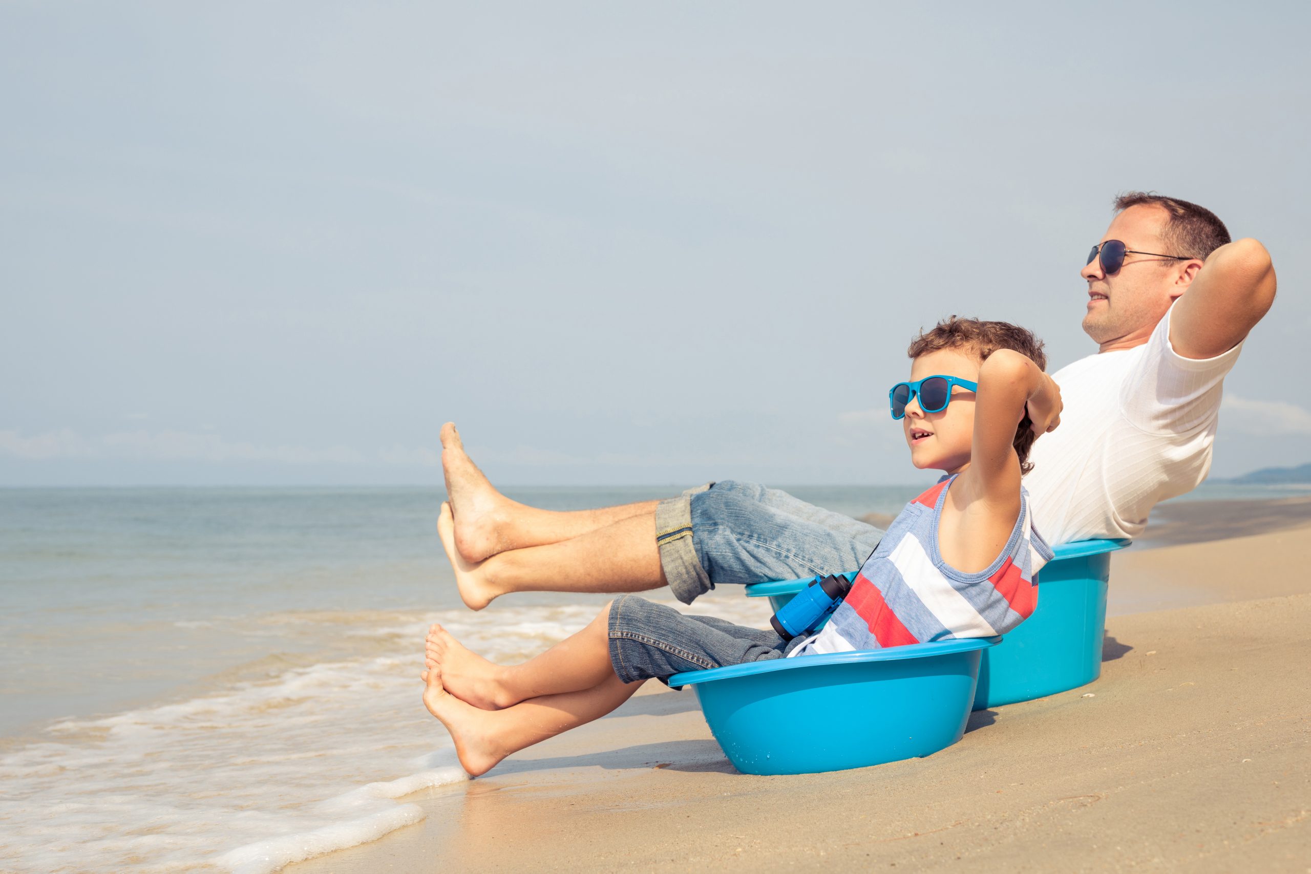 Father,And,Son,Playing,On,The,Beach,At,The,Summer